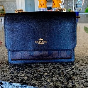 Year old with beautiful coach crossbody in great condition inside and out